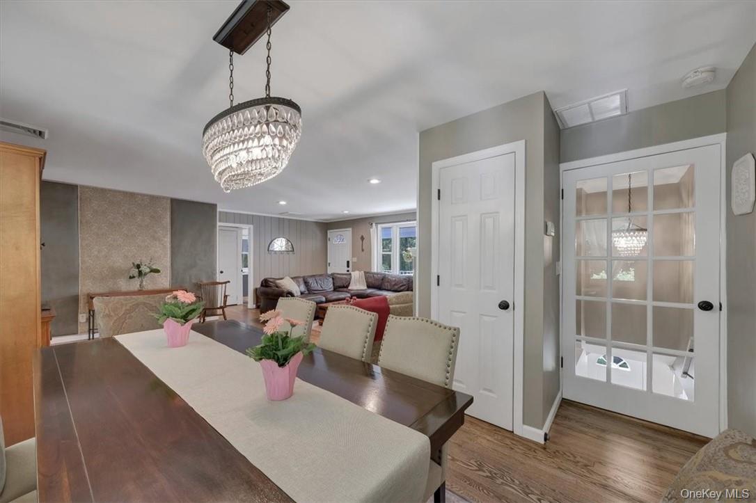 13 Split Rock Road Mahopac, NY 10541 - Photo 9 of 36 a view of a dining room with furniture wooden floor and chandelier