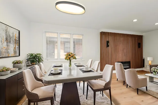 a dining room with furniture and window