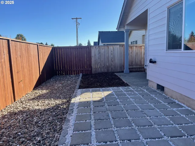 a view of a backyard with a patio
