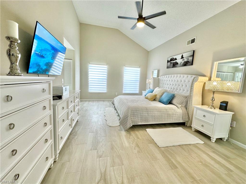 3639 Kent Drive Naples, FL 34112 - Photo 26 of 40 a bedroom with a bed and a couch