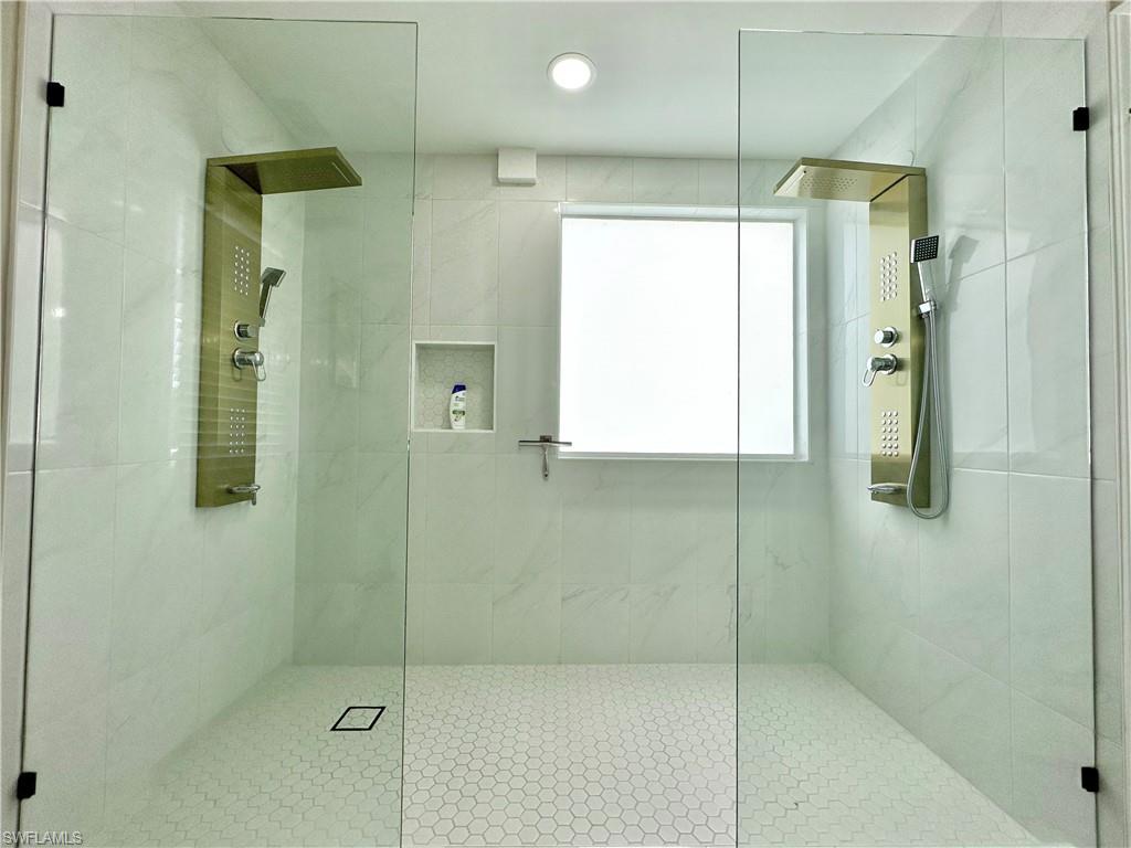3639 Kent Drive Naples, FL 34112 - Photo 32 of 40 a bathroom with a shower and a sink