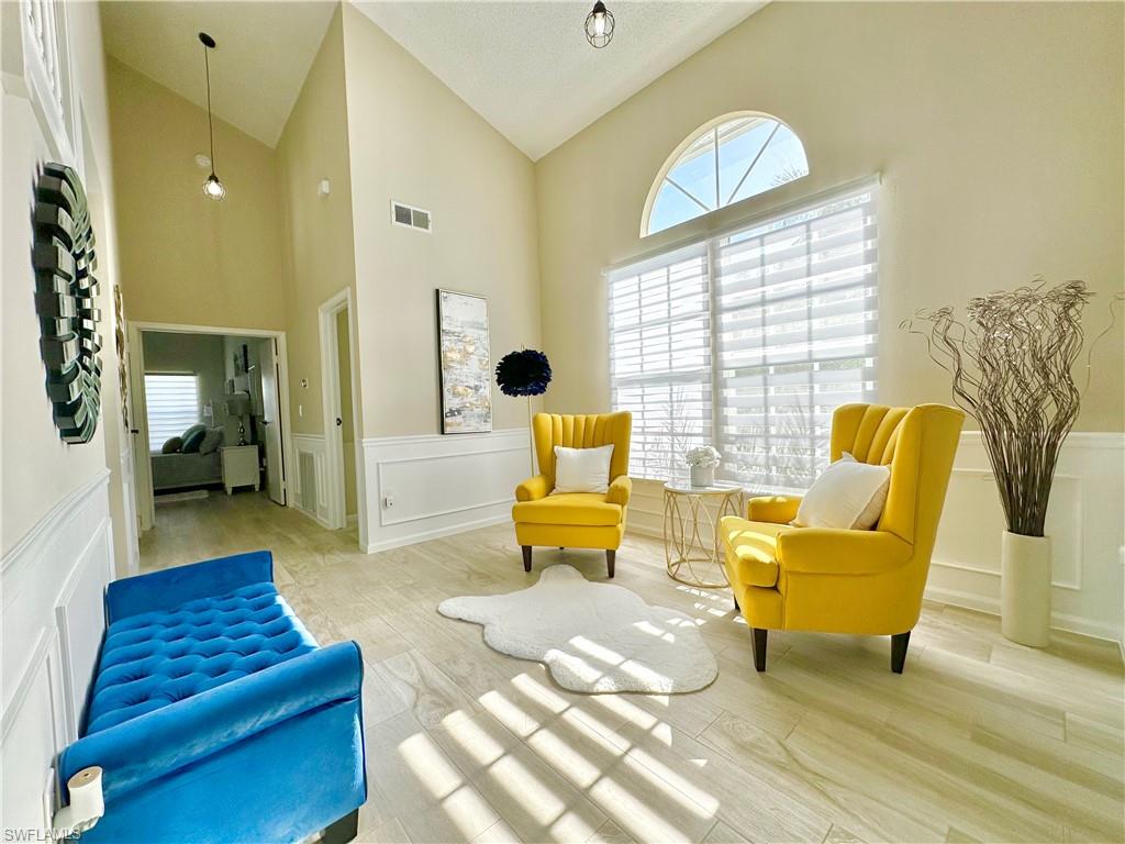 3639 Kent Drive Naples, FL 34112 - Photo 5 of 40 a living room with furniture and a fireplace