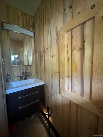 a bathroom with a sink and mirror