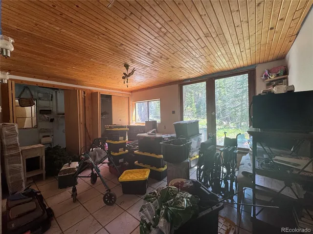 a living room with furniture a fireplace and a table