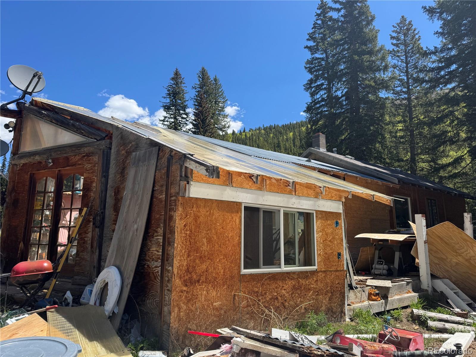 4568 Apex Valley Road Idaho Springs, CO 80452 - Photo 19 of 29 a backyard of a house with seating space