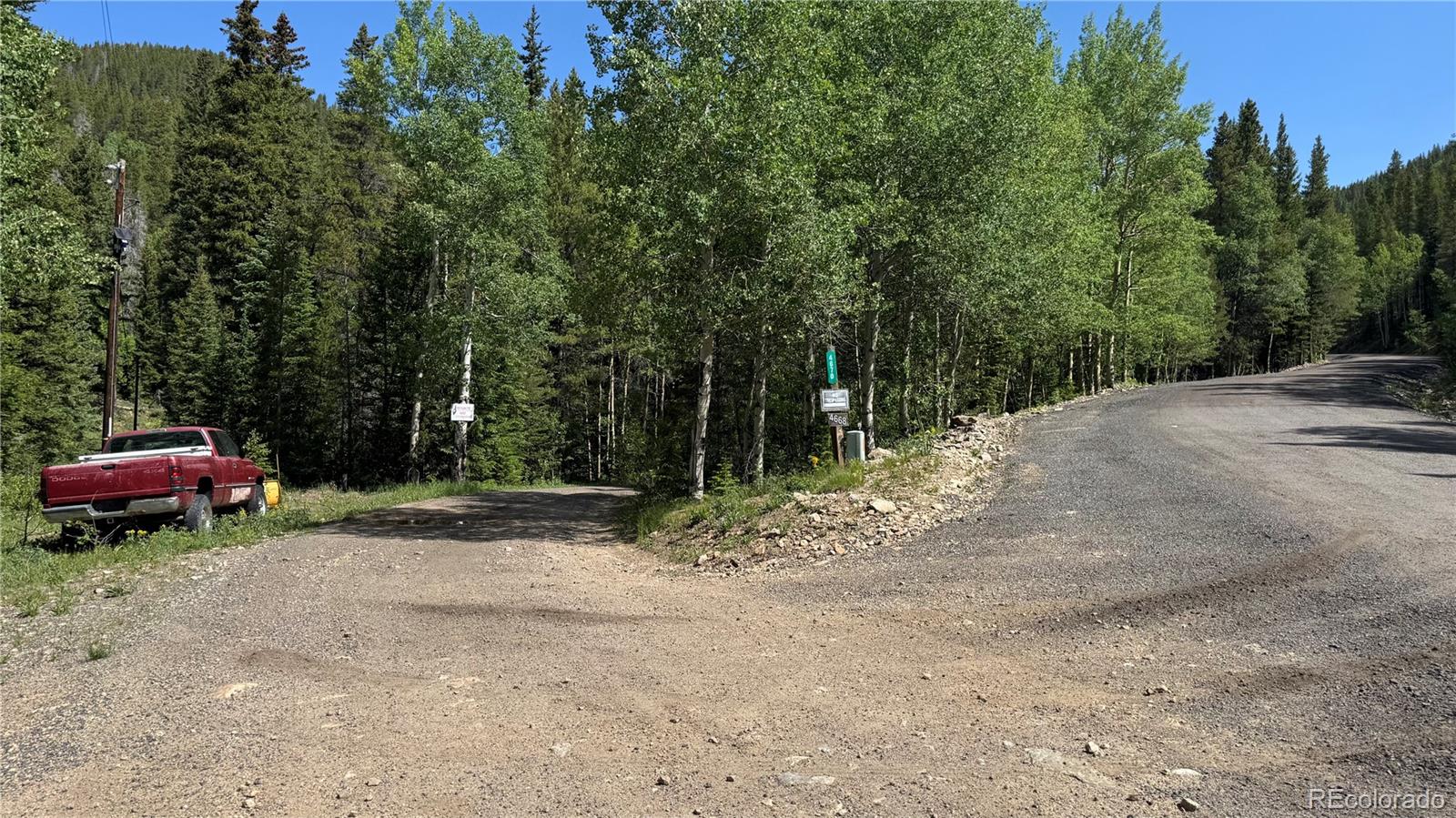 4568 Apex Valley Road Idaho Springs, CO 80452 - Photo 24 of 29 a dirt road with trees and a trees