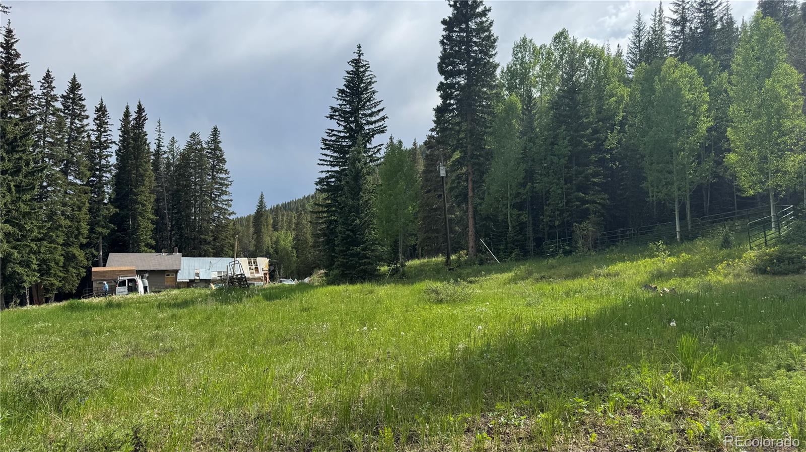 4568 Apex Valley Road Idaho Springs, CO 80452 - Photo 27 of 29 a view of a chair and table and chairs in the garden