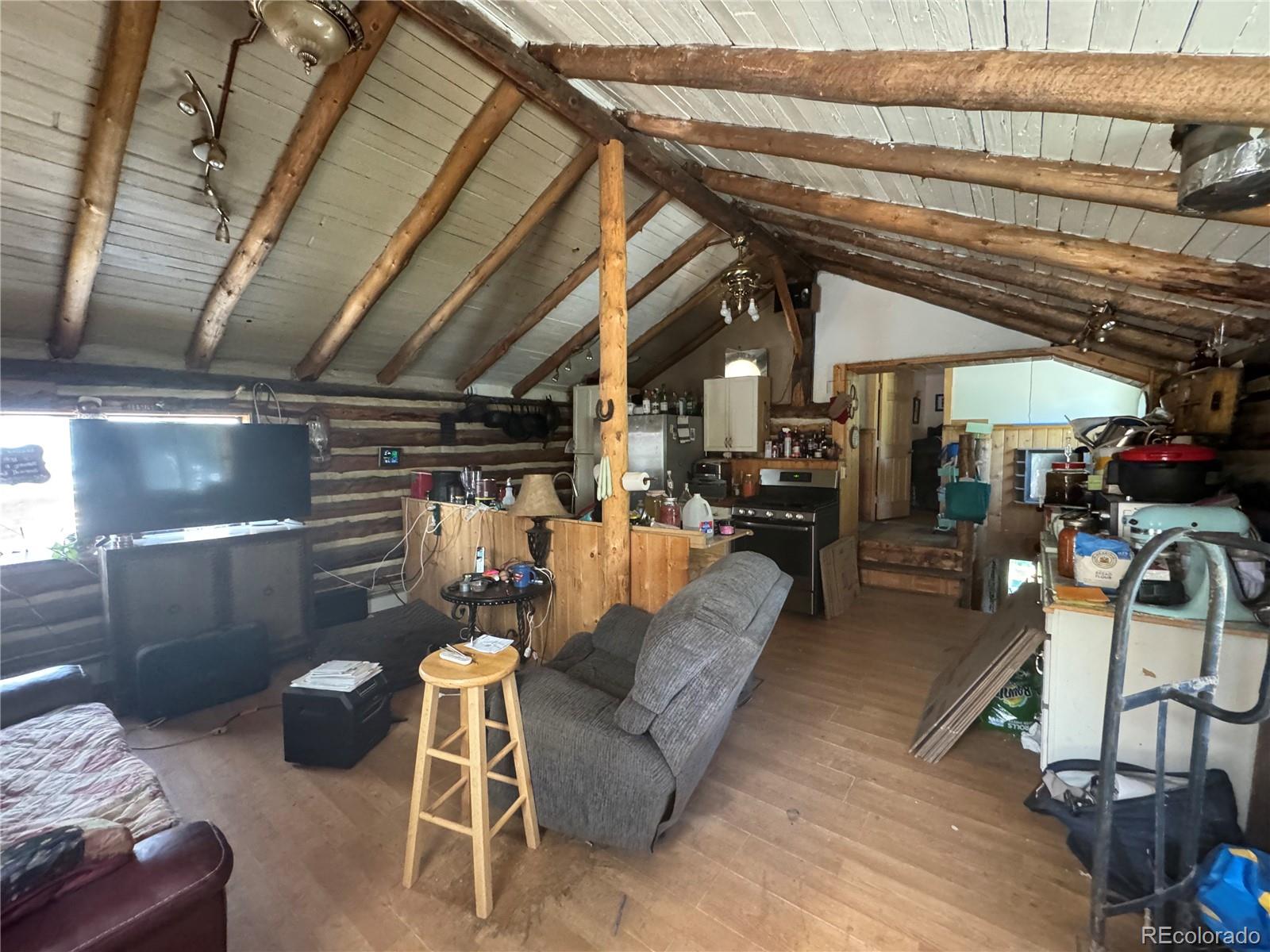 4568 Apex Valley Road Idaho Springs, CO 80452 - Photo 8 of 29 a view of a couch with wooden floor