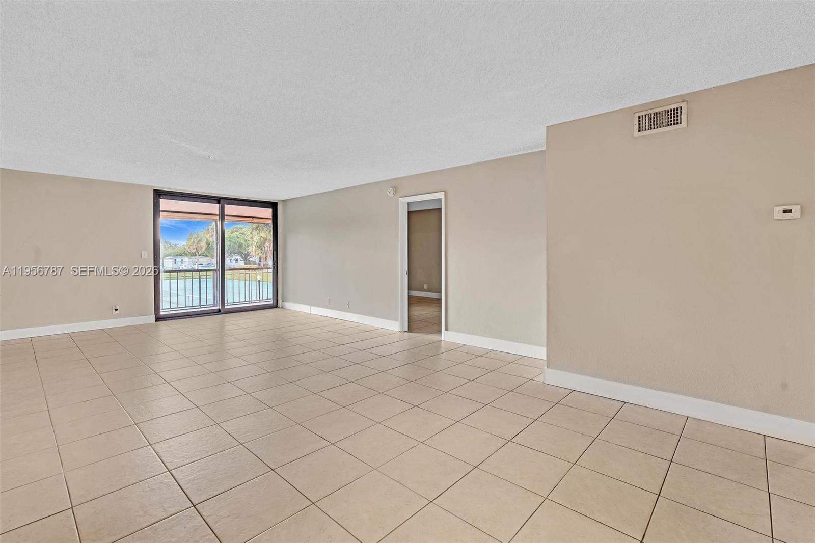 400 Commodore Drive, Unit 215 Plantation, FL 33325 - Photo 13 of 30 a view of an empty room with window