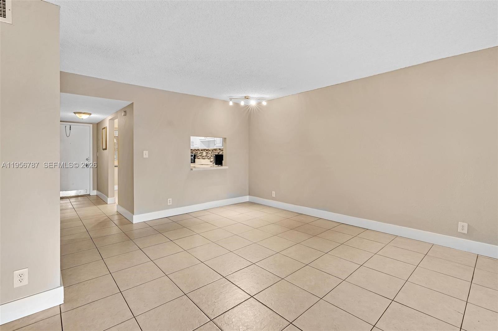 400 Commodore Drive, Unit 215 Plantation, FL 33325 - Photo 16 of 30 a view of an empty room and window