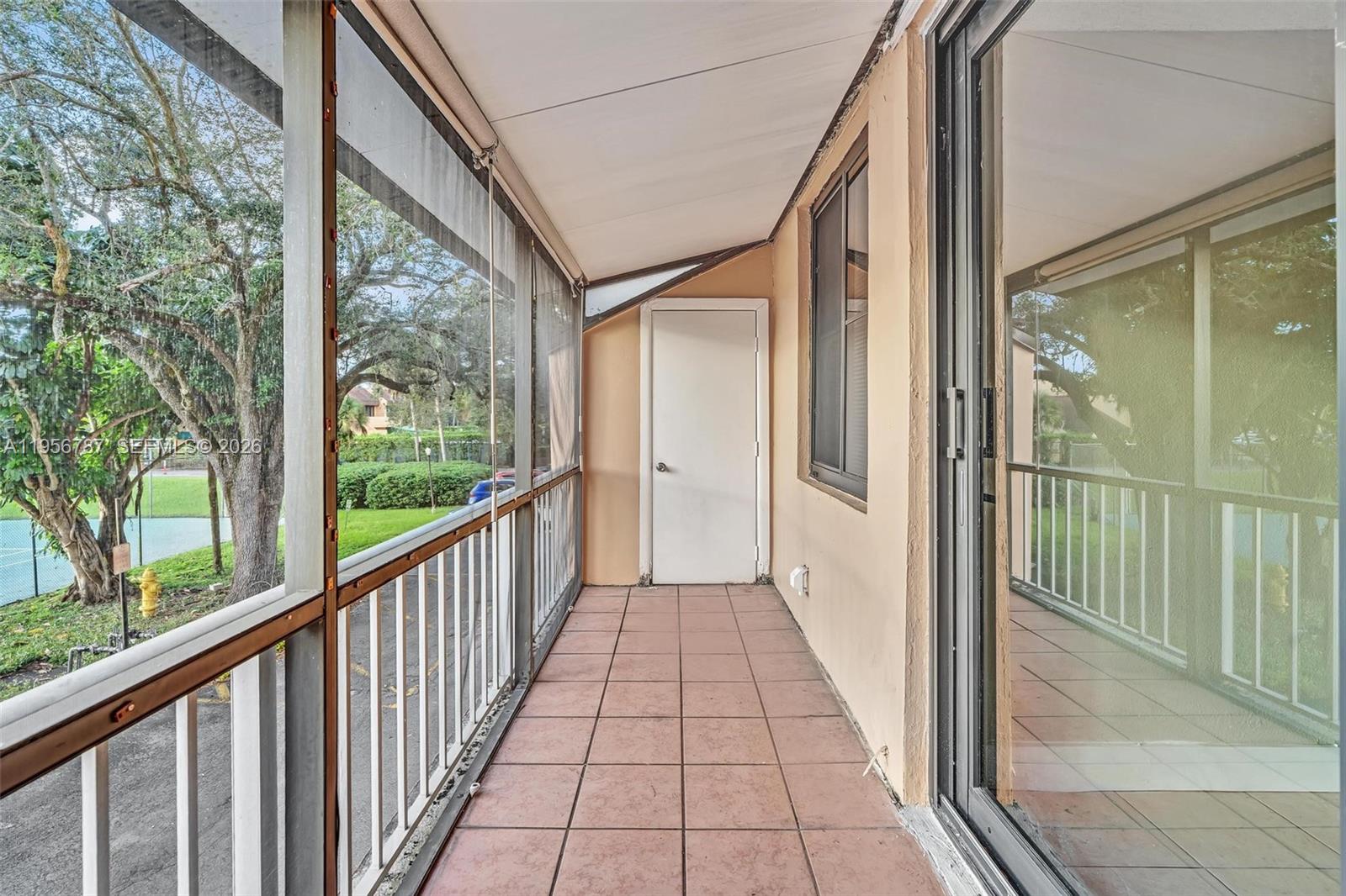 400 Commodore Drive, Unit 215 Plantation, FL 33325 - Photo 20 of 30 a view of a narrow alley