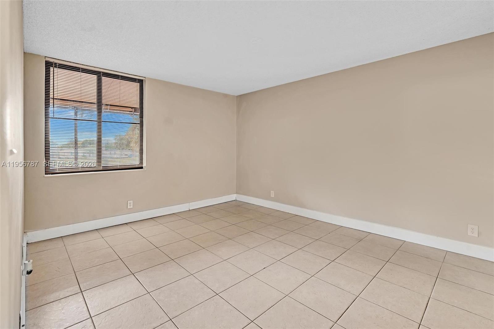 400 Commodore Drive, Unit 215 Plantation, FL 33325 - Photo 22 of 30 an empty room with windows
