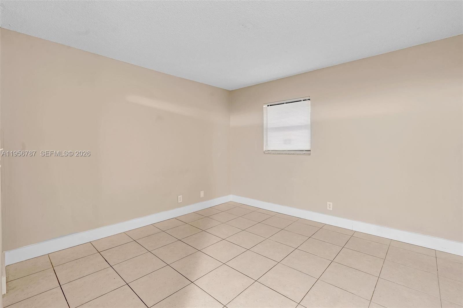 400 Commodore Drive, Unit 215 Plantation, FL 33325 - Photo 27 of 30 an empty room with windows