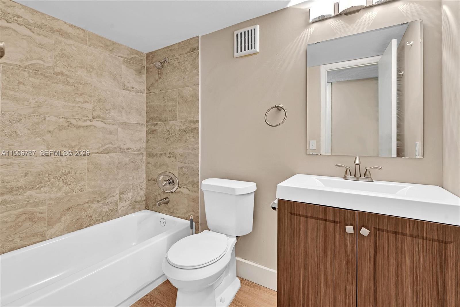 400 Commodore Drive, Unit 215 Plantation, FL 33325 - Photo 30 of 30 a bathroom with a sink a toilet and shower