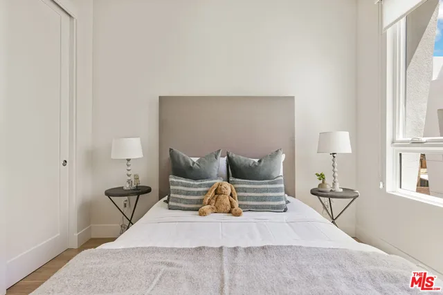 a bed room with furniture and lamp