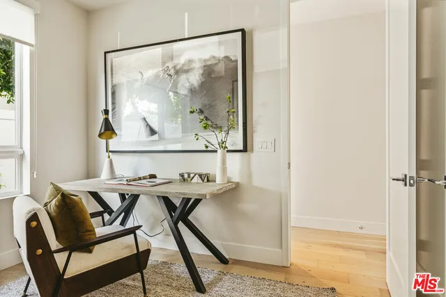 a view of a dining room with furniture and window