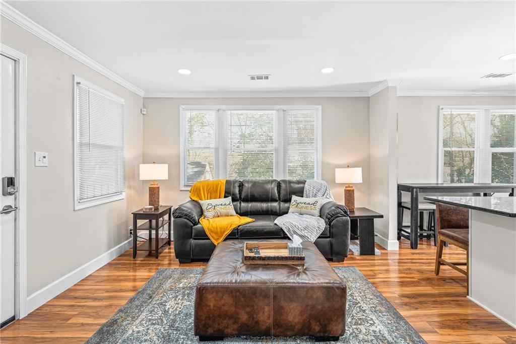 1298 Douglas Street Southwest, Unit A Atlanta, GA 30314 - Photo 2 of 11 a living room with furniture and a large window