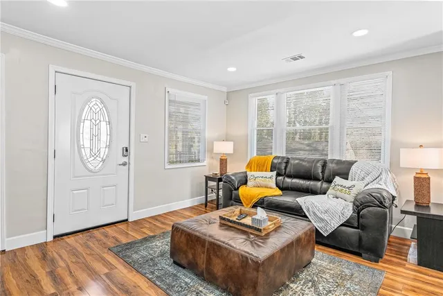 a living room with furniture rug and window