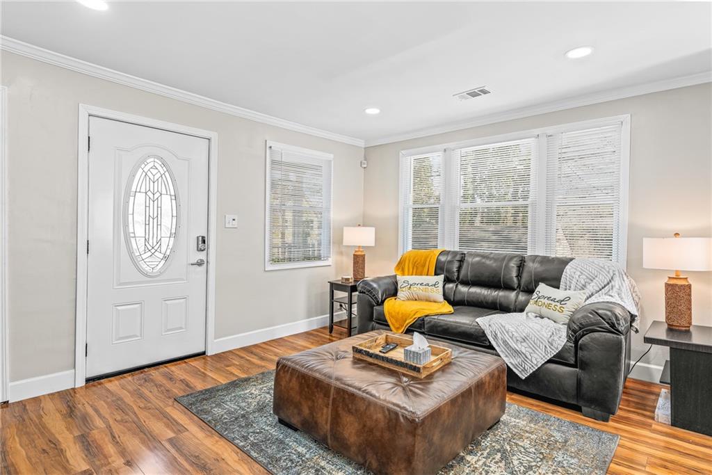 1298 Douglas Street Southwest, Unit A Atlanta, GA 30314 - Photo 3 of 11 a living room with furniture rug and window
