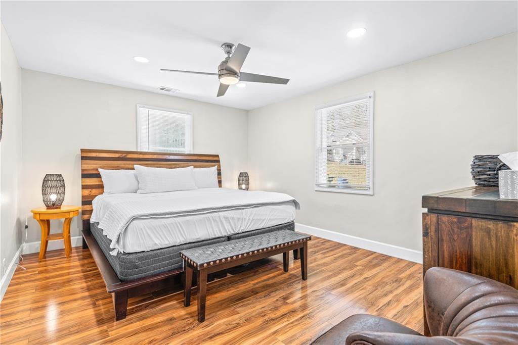 1298 Douglas Street Southwest, Unit A Atlanta, GA 30314 - Photo 6 of 11 a bedroom with a bed and wooden floor