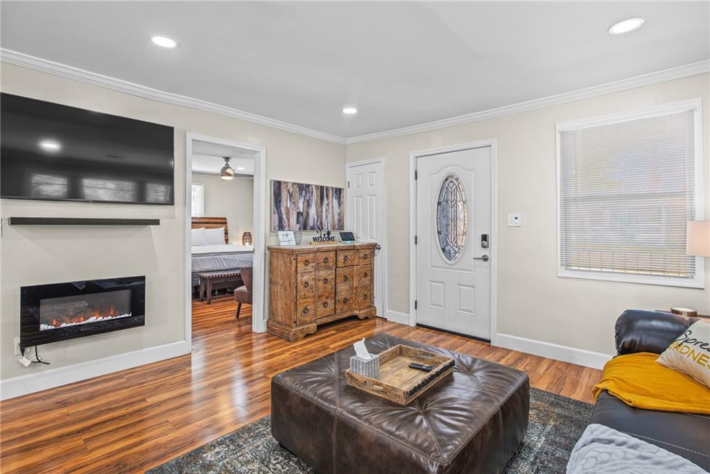 1298 Douglas Street Southwest, Unit A Atlanta, GA 30314 - Photo 8 of 11 a living room with furniture and a fireplace