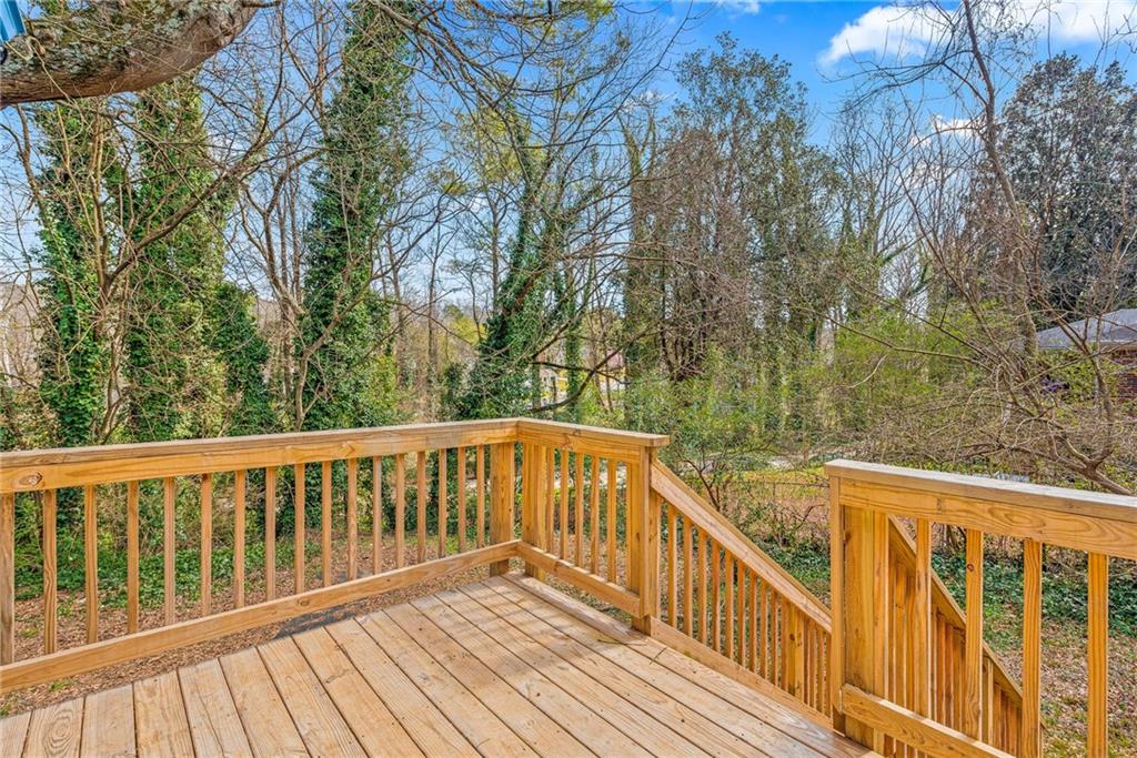 1298 Douglas Street Southwest, Unit A Atlanta, GA 30314 - Photo 10 of 11 a view of balcony with wooden floor and fence