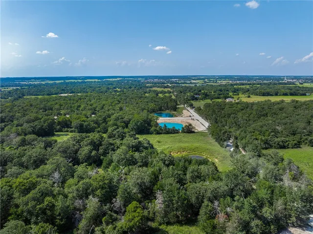 a aerial view of a house with a yard
