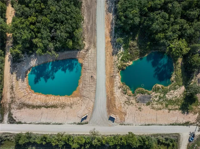 an aerial view of a house with outdoor space