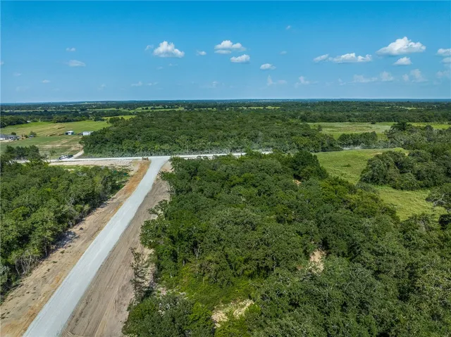 a view of a city and an ocean from a balcony