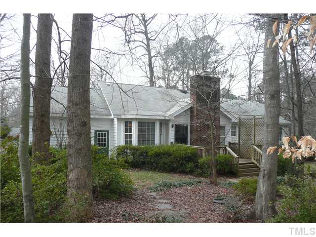 8312 North Creek Run Raleigh, NC 27613 - Photo 16 of 17 a front view of house with yard and trees around