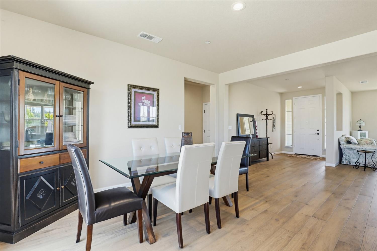 21456 Rucker Court Grass Valley, CA 95949 - Photo 13 of 74 a view of a livingroom with furniture and a dining table with wooden floor