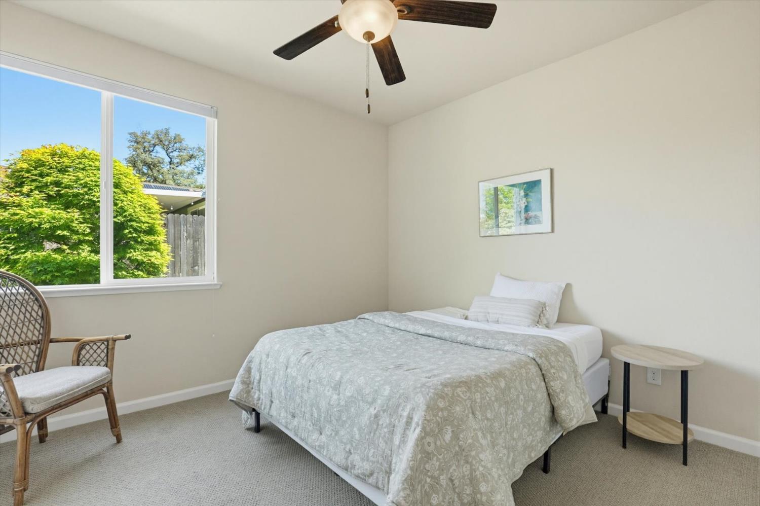 21456 Rucker Court Grass Valley, CA 95949 - Photo 25 of 74 a bedroom with a bed and a chair
