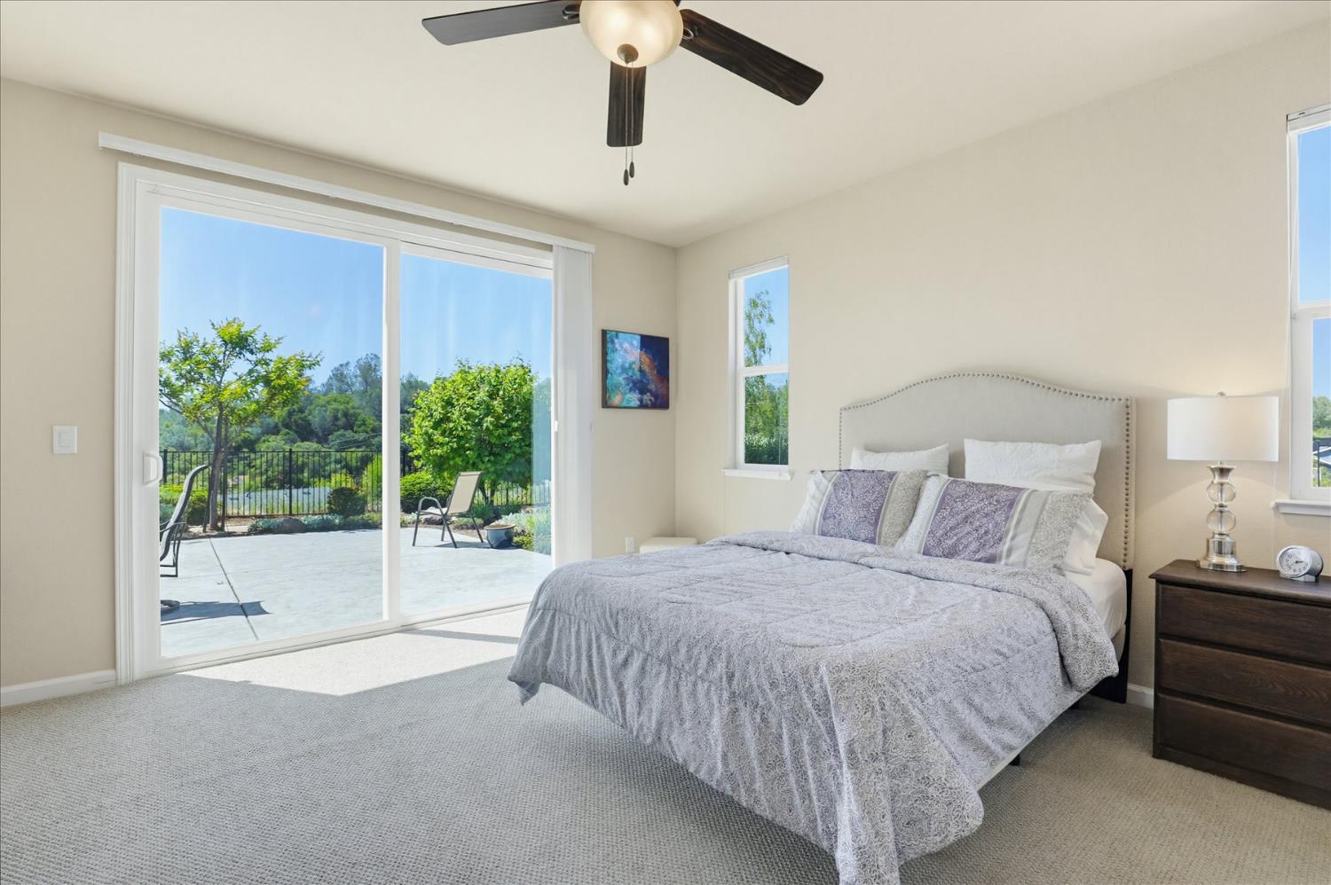 21456 Rucker Court Grass Valley, CA 95949 - Photo 35 of 74 a bedroom with a large bed and a large window