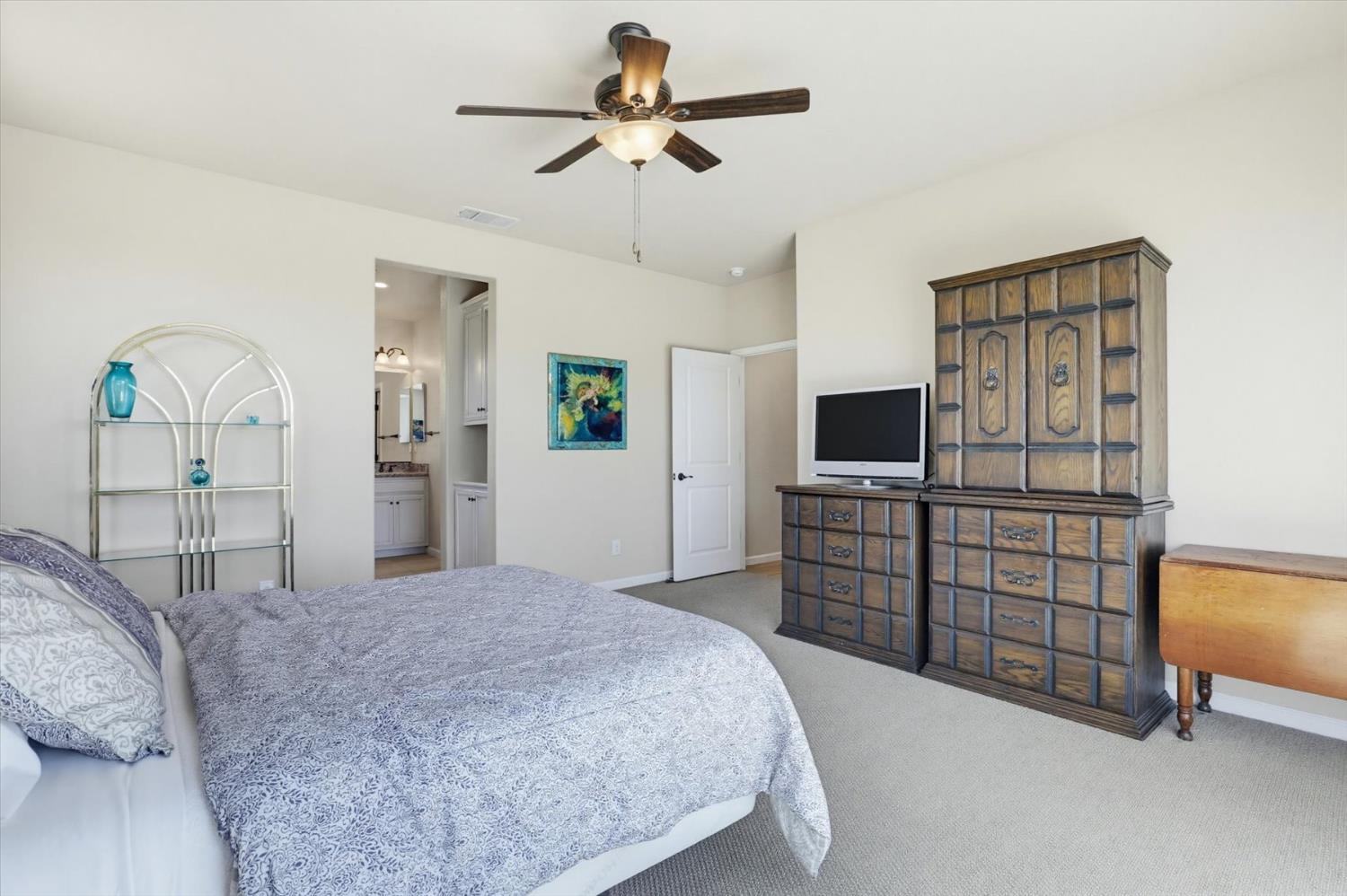 21456 Rucker Court Grass Valley, CA 95949 - Photo 37 of 74 a bedroom with a bed and a flat screen tv