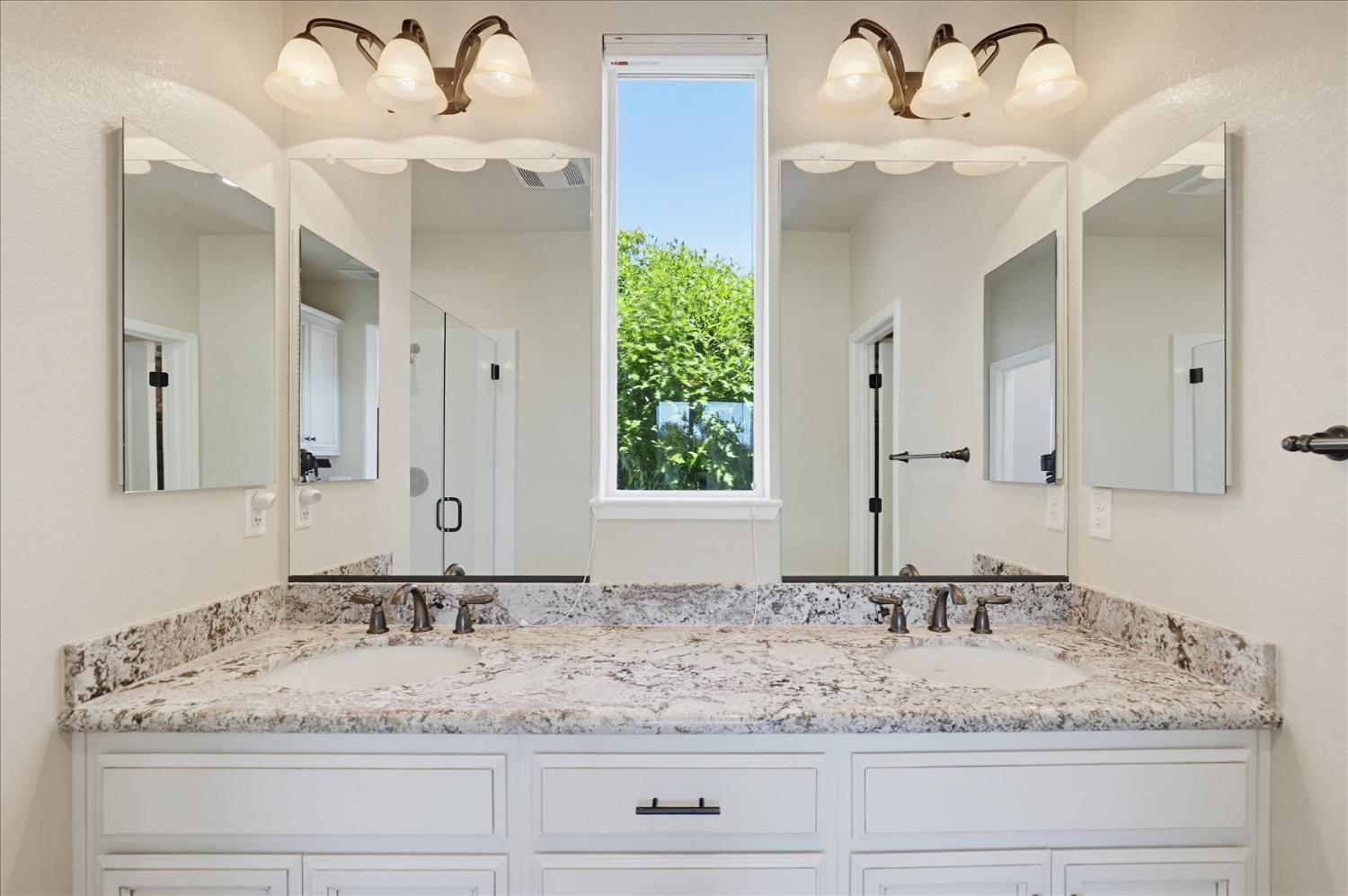 21456 Rucker Court Grass Valley, CA 95949 - Photo 40 of 74 a bathroom with a granite countertop sink and a mirror
