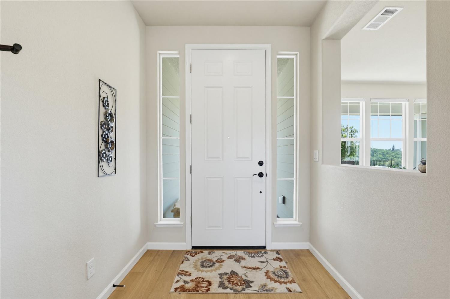 21456 Rucker Court Grass Valley, CA 95949 - Photo 5 of 74 a view of hallway with window and wooden floor
