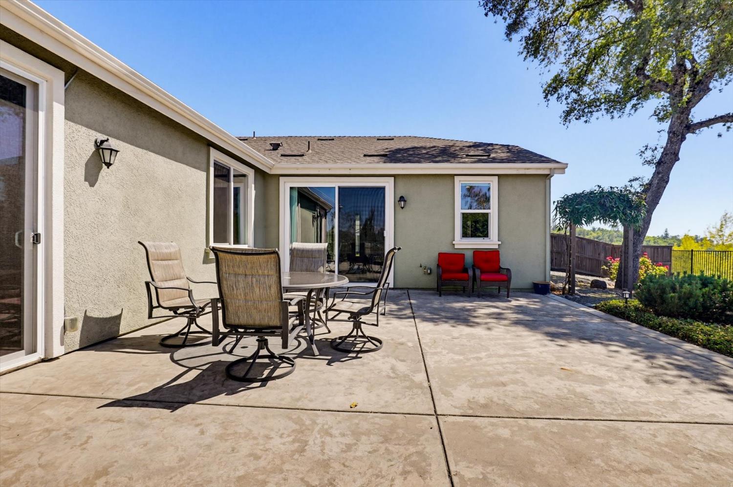 21456 Rucker Court Grass Valley, CA 95949 - Photo 56 of 74 a view of a patio with table and chairs and potted plants