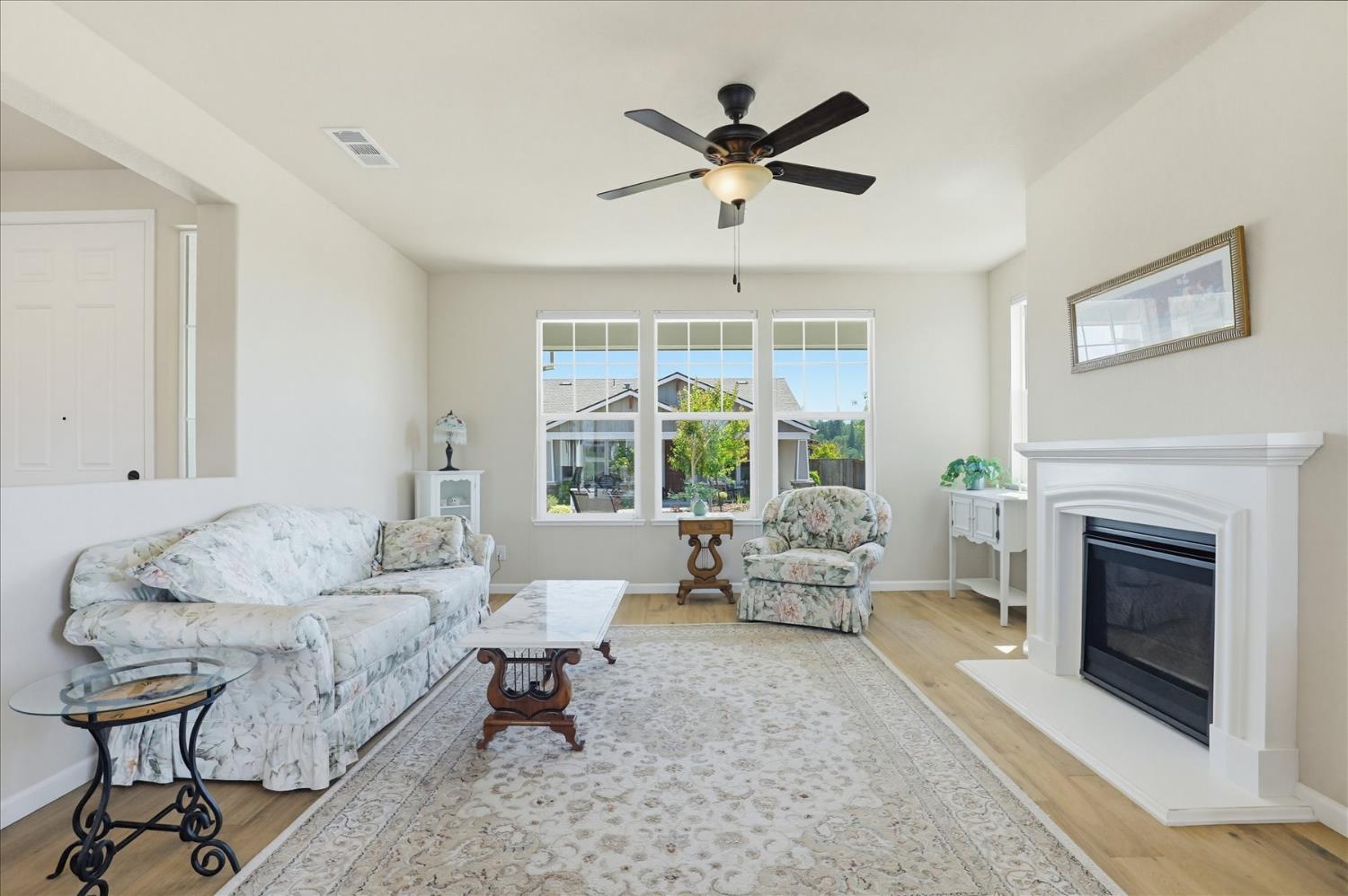 21456 Rucker Court Grass Valley, CA 95949 - Photo 6 of 74 a living room with furniture and a fireplace