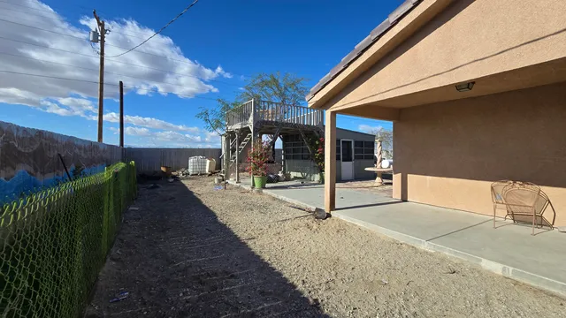 a view of a sink and wooden cabinets