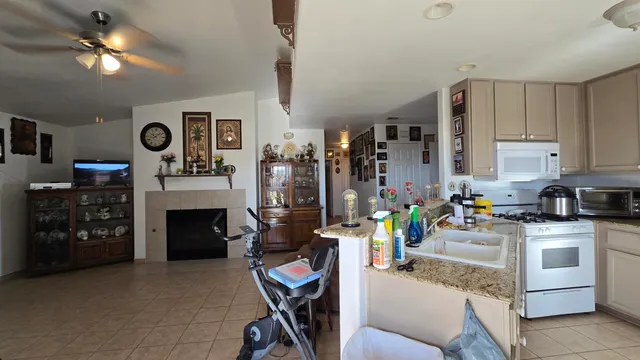 a kitchen with stainless steel appliances granite countertop a stove and cabinets