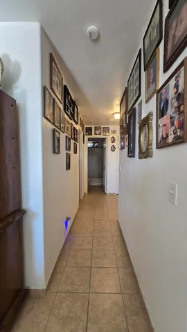 a hallway with cabinets