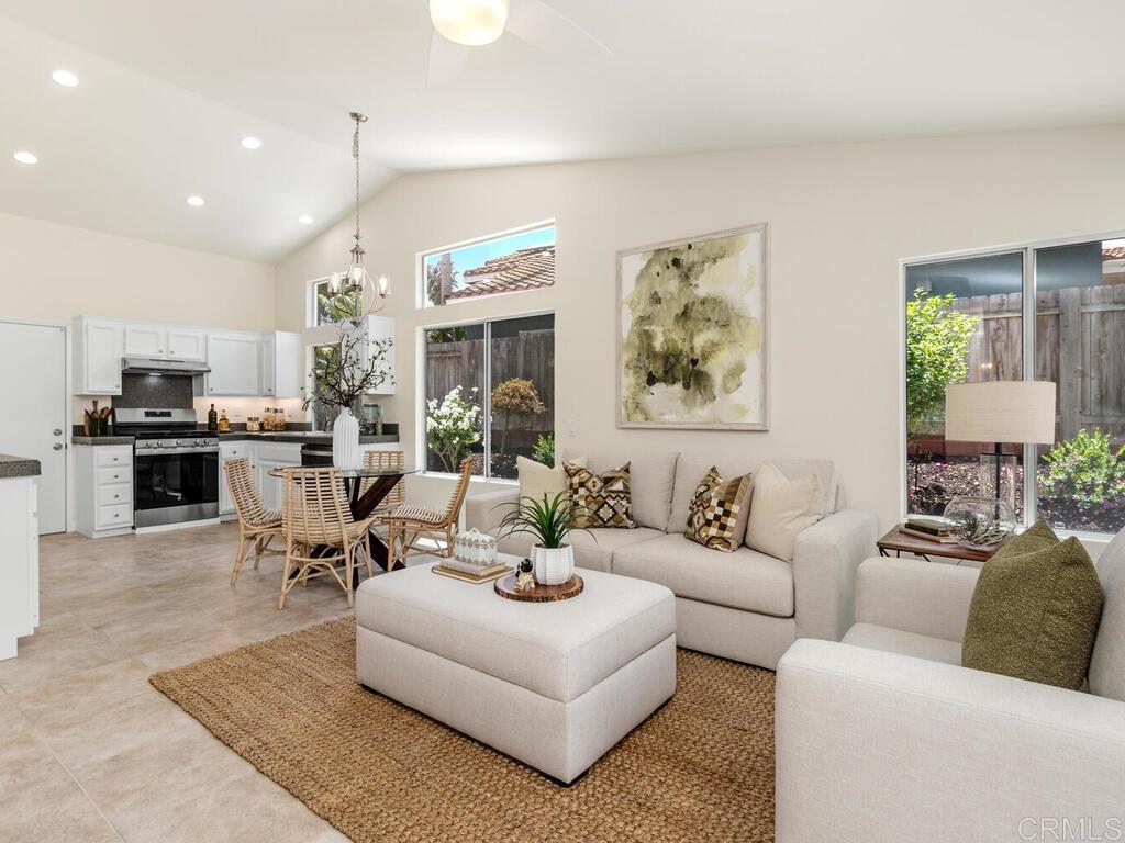 1219 Sunglow Drive Oceanside, CA 92056 - Photo 16 of 40 The windows on this side look out to the brilliantly landscaped green, pink & white bushes.