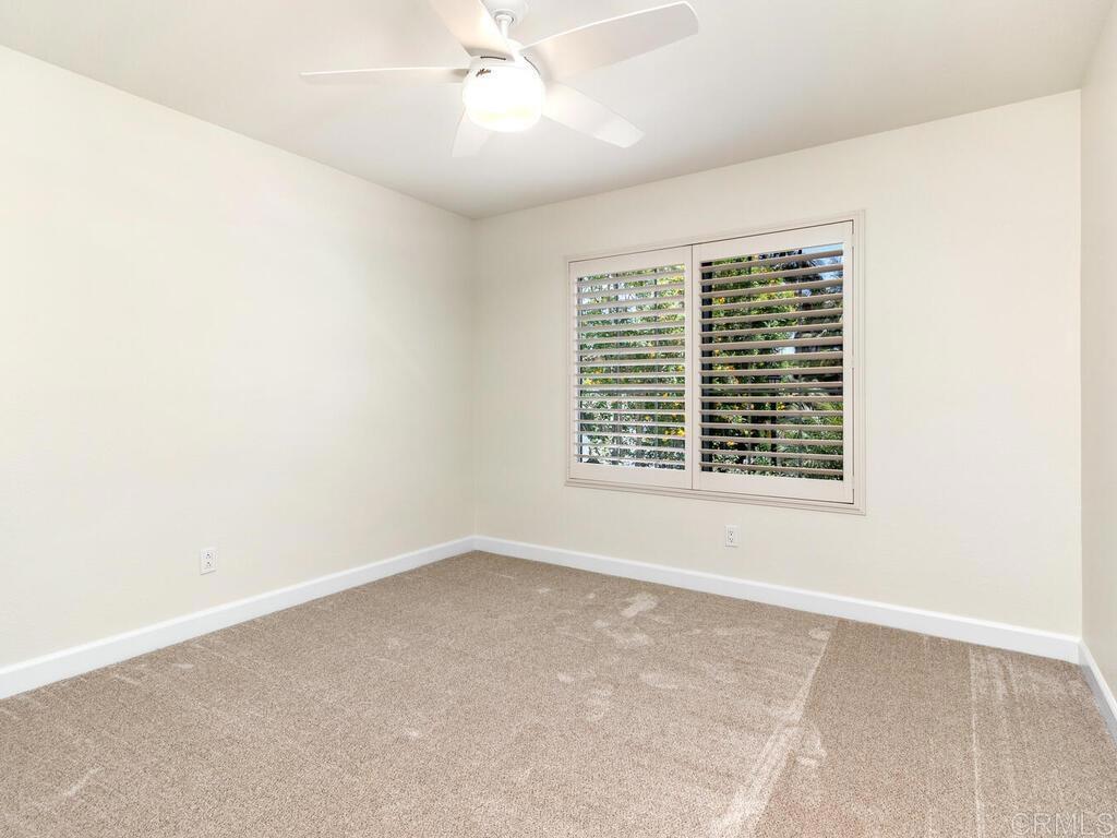 1219 Sunglow Drive Oceanside, CA 92056 - Photo 27 of 40 This Bedroom has a large picture window with a shutter looking out to the front yard.