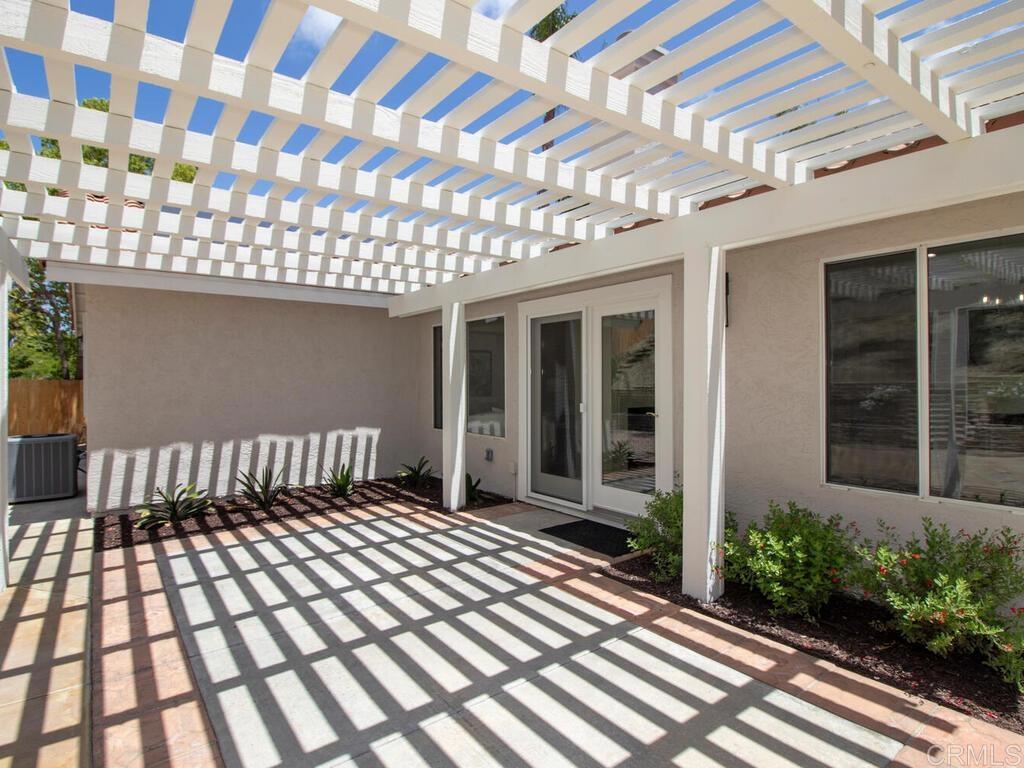 1219 Sunglow Drive Oceanside, CA 92056 - Photo 29 of 40 The pergola creates the perfect transition from inside entertaining to outside entertaining.