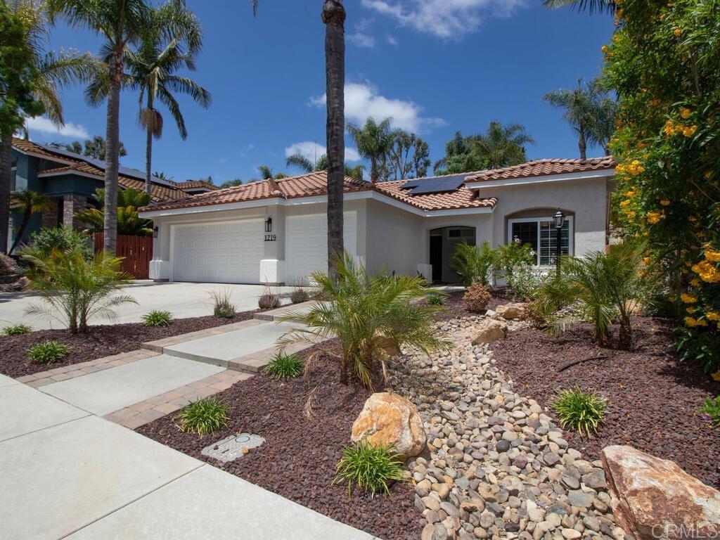 1219 Sunglow Drive Oceanside, CA 92056 - Photo 3 of 40 It is hard to get past the extensively landscaped front yard.