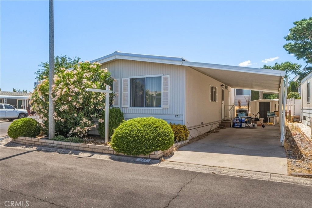 20683 Waalew Road, Unit B201 Apple Valley, CA 92307 - Photo 1 of 32 a view of a house with backyard