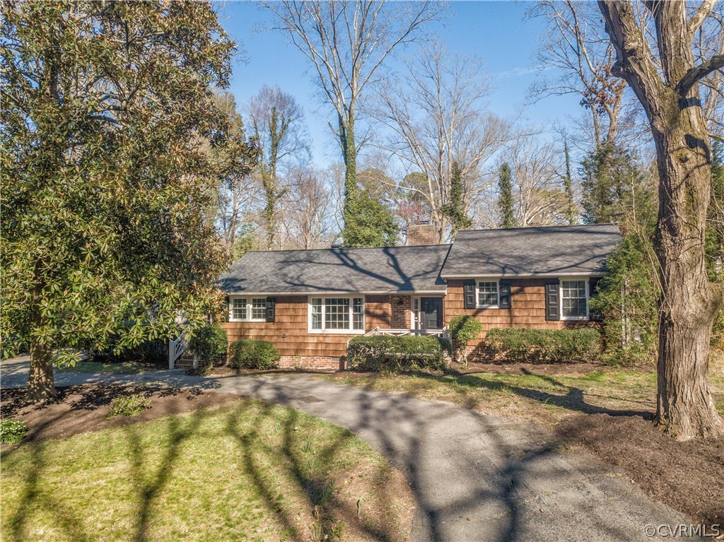 3921 Wakefield Road Richmond, VA 23235 - Photo 1 of 50 a front view of a house with a yard
