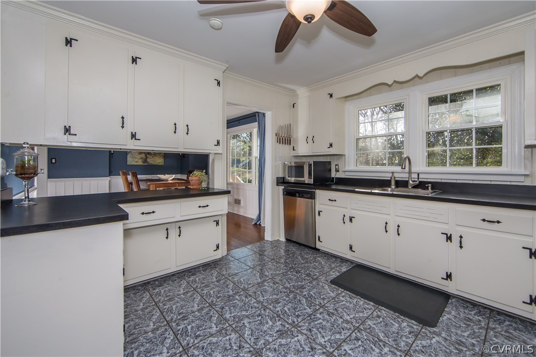 3921 Wakefield Road Richmond, VA 23235 - Photo 13 of 50 a kitchen with granite countertop white cabinets white stainless steel appliances with a sink and dishwasher