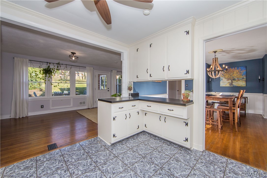 3921 Wakefield Road Richmond, VA 23235 - Photo 15 of 50 a kitchen with stainless steel appliances kitchen island granite countertop a stove a sink and a microwave