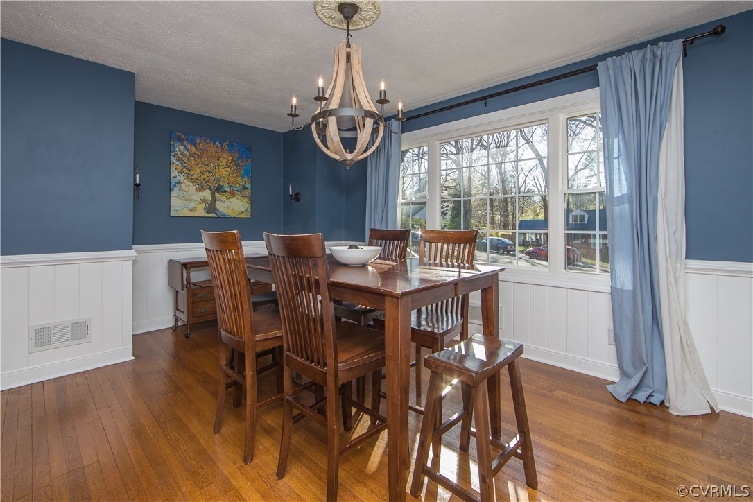 3921 Wakefield Road Richmond, VA 23235 - Photo 17 of 50 a view of a dining room with furniture window and wooden floor